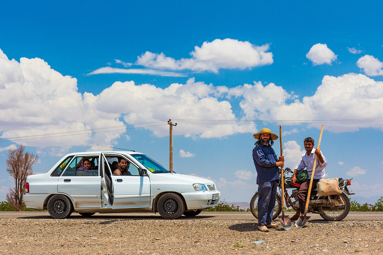 On our way from Yazd to Kerman we travelled through Iran’s main pistachio growing region. The coach pulled over to let us see the pistachio trees and I gestured to ask permission to photograph these workers chatting by the road.