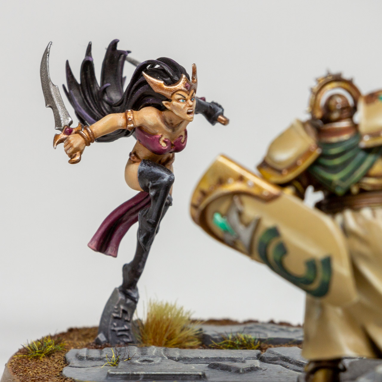 Closeup of an elf duelling a knight.