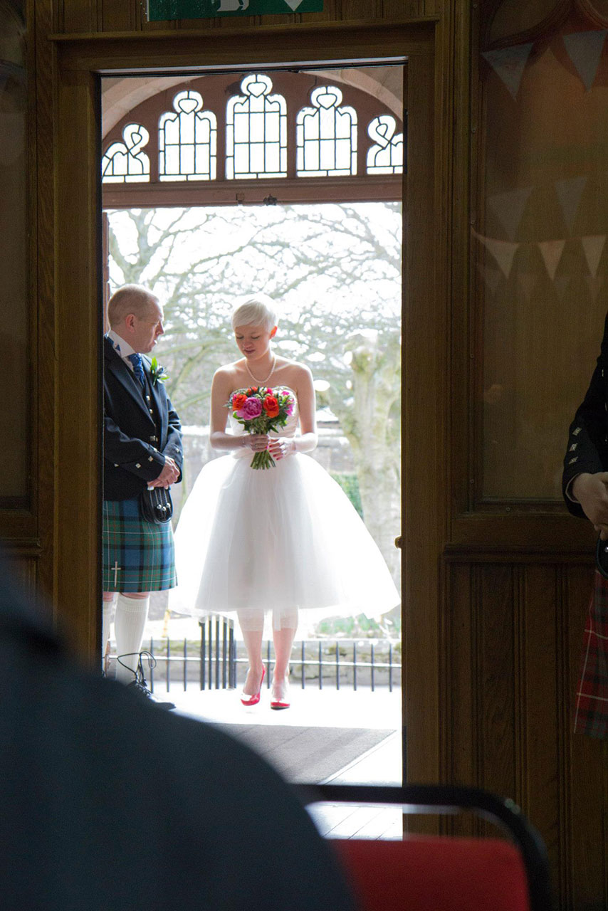 The bride arrives for her small church wedding.